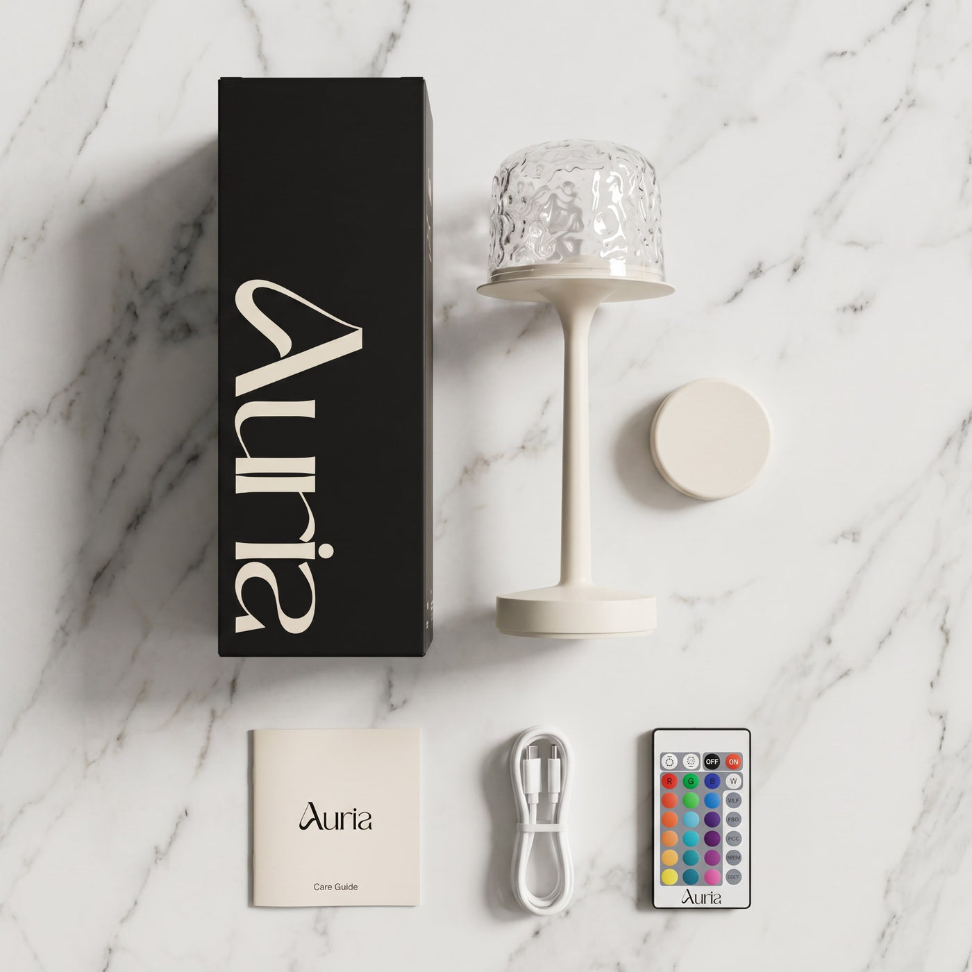 Everything in the Auria Glow box: branded box, lamp, silicone cap, care guide, USB C cable and Chromashift remote